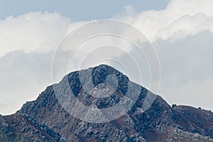 One Unique Hill Peak with blue sky and clouds in the background -nature concept