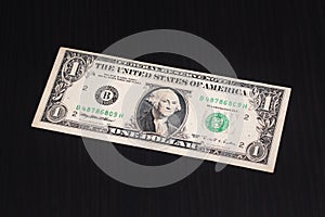 One United States Dollar on dark background. 1 US Dollar banknote