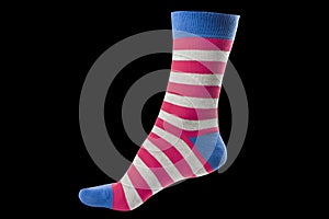 One volumetric sock with different lines isolated on black background. Colorful volumetric sock. Colored socks on the leg isolated