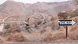 One way road sign arrow, highway roadside in California, USA road trip in desert