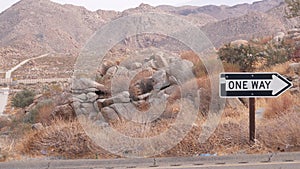 One way road sign arrow, highway roadside in California, USA road trip in desert