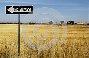 One Way Sign in Dry Grassy Field