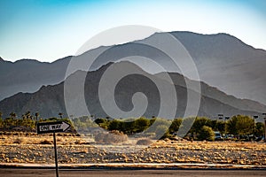 A One Way Sign By the Side of the Road In Indio, California at Sunset photo