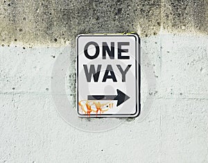 One way sign with tag