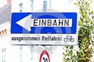 One-way street, road sign with additional