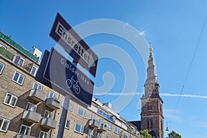 One-way-street sign pointing at church