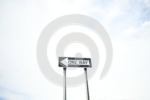 one way street sign points the way