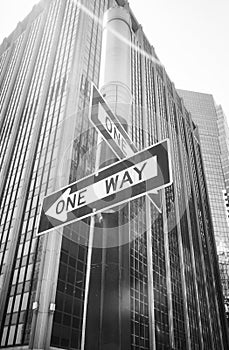 One Way street signs on a lamp post with lens flare, New York City, USA