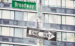 One Way traffic sign at Broadway road, color toning applied, selective focus, New York City, USA