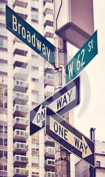 One Way traffic signs at Broadway road, color toning applied, New York City, USA