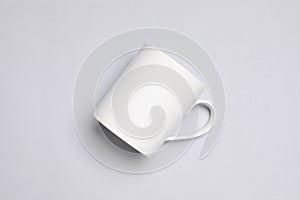 One white ceramic mug on light background, top view