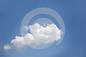 One white cloud floats on clear blue sky background