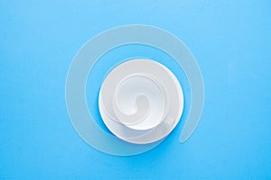 One White Empty Tea or Coffee Cup with Saucer on Light Blue Background. Top View. Mock up for Different Beverages Collage Element