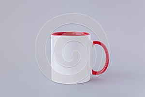 One white mug, red handle