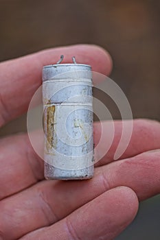 one white old metal electronic part barrel