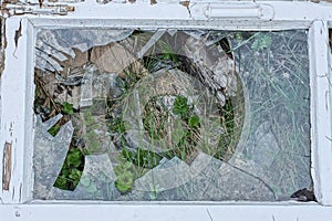 one white old wooden frame with broken glass