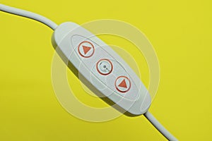 One white plastic electrical switch with red buttons