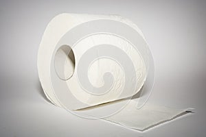 One white toilet paper on the white background with shadows