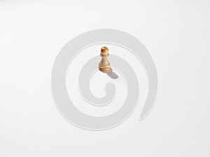 One white wooden chess pawn on white background