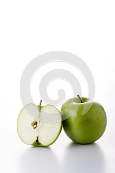 One whole and one half green apples