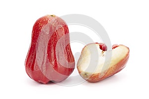 One whole and half java apple on white background
