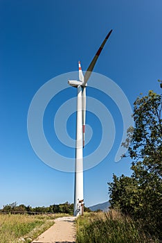 One wind turbine above the hill - Renewable energy