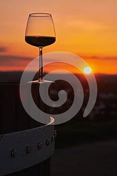 One wine glasses on a wine press in sunset in Mainz