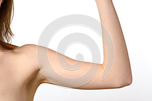 One woman bare shoulder and arm bent at the elbow