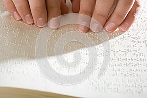 One woman reading braille