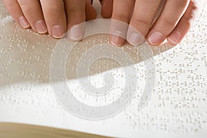 One woman reading braille photo