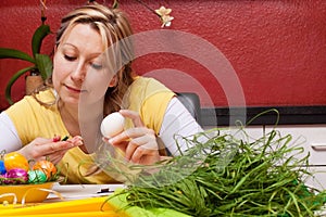 One woman tinkering an easter nest