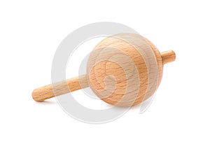 One wooden spinning top isolated on white. Toy whirligig