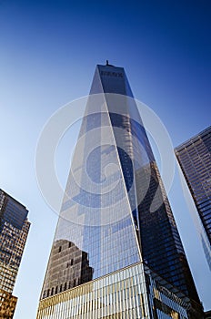 The One World Trade center or Freedom Tower located in New York City. Architectural modern buildings at lower Manhattan skyline.