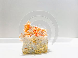 Sushi with sesame seeds and kani topping - crab sushi photo