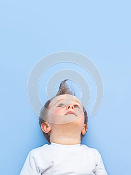 One year nine month old boy looking up