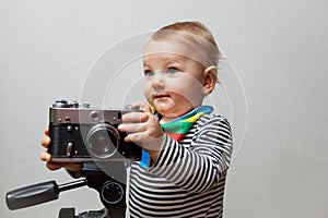 One year old baby boy with camera