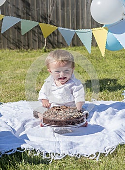 One year old baby boy chocolate cake smash