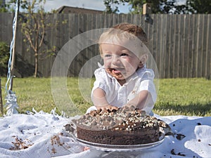 One year old baby boy chocolate cake smash