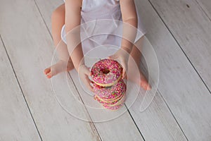 One year old baby girl celebrates her birthday. Close up.