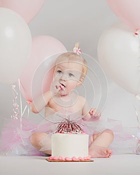 One Year Old Birthday Portraits with smash cake and balloons