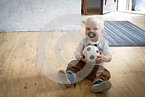 One year old boy with ball