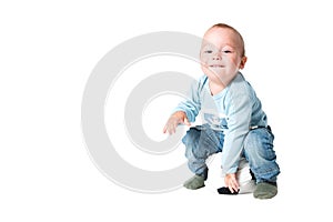 One year old boy playing with the ball