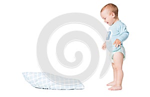 One year old boy playing with the pillow