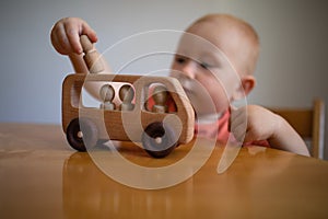 One year old child plays with Montessori materials.