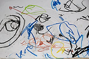 One year old child\'s hand drawing with crayons