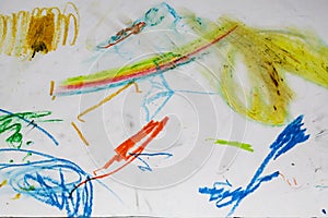 One year old child\'s hand drawing with crayons