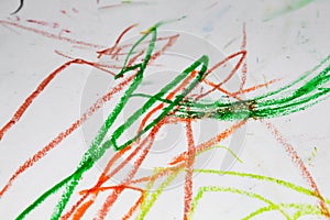 One year old child\'s hand drawing with crayons