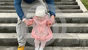 One year old girl with father climb up