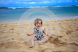 One Year Old Girl Playing In Sand