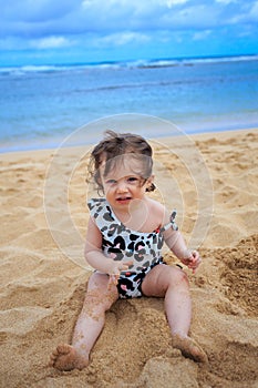 One Year Old Girl Playing In Sand